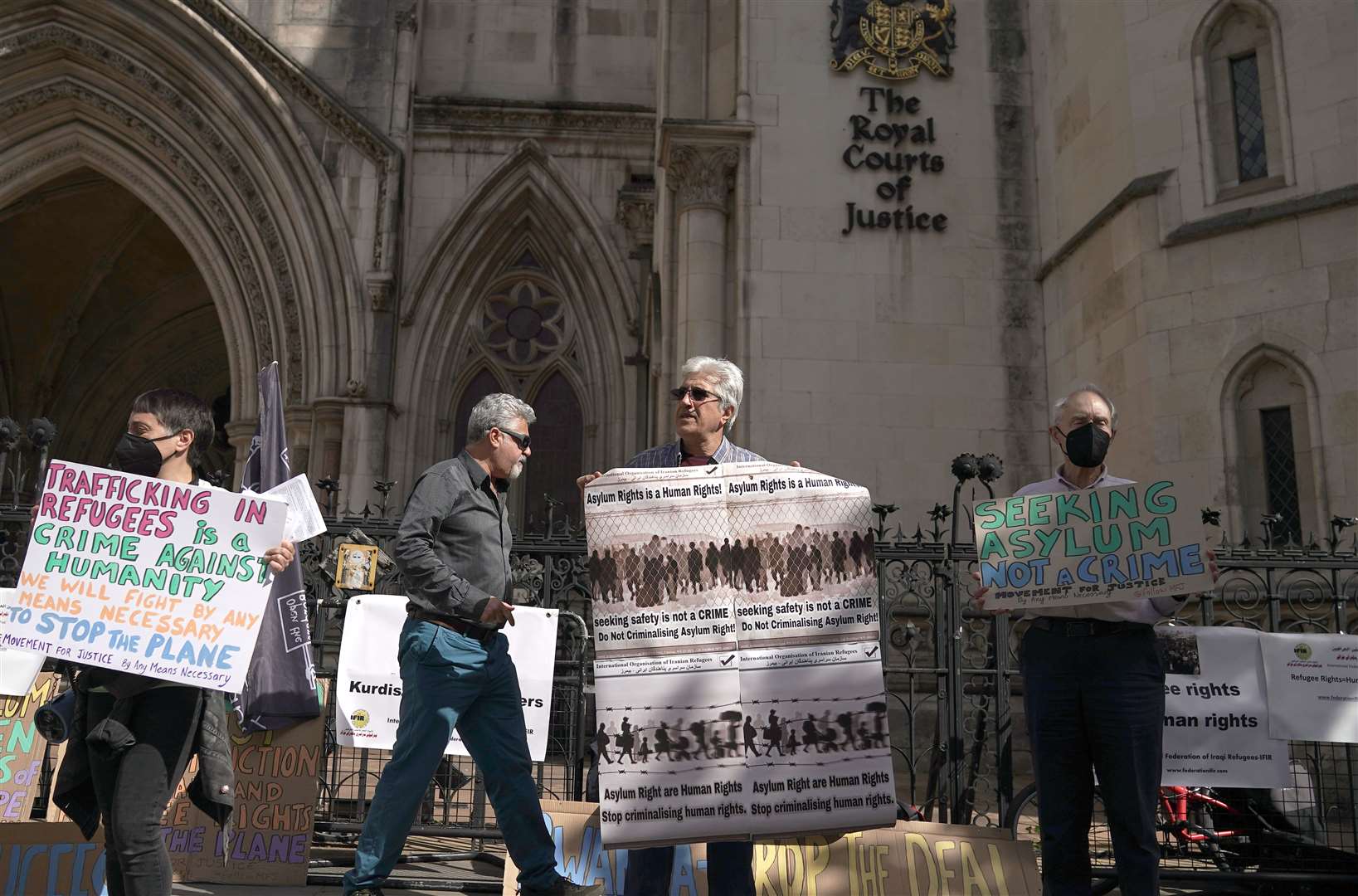 Protesters outside the High Court over the Rwanda deportation flights (Aaron Chown/PA)
