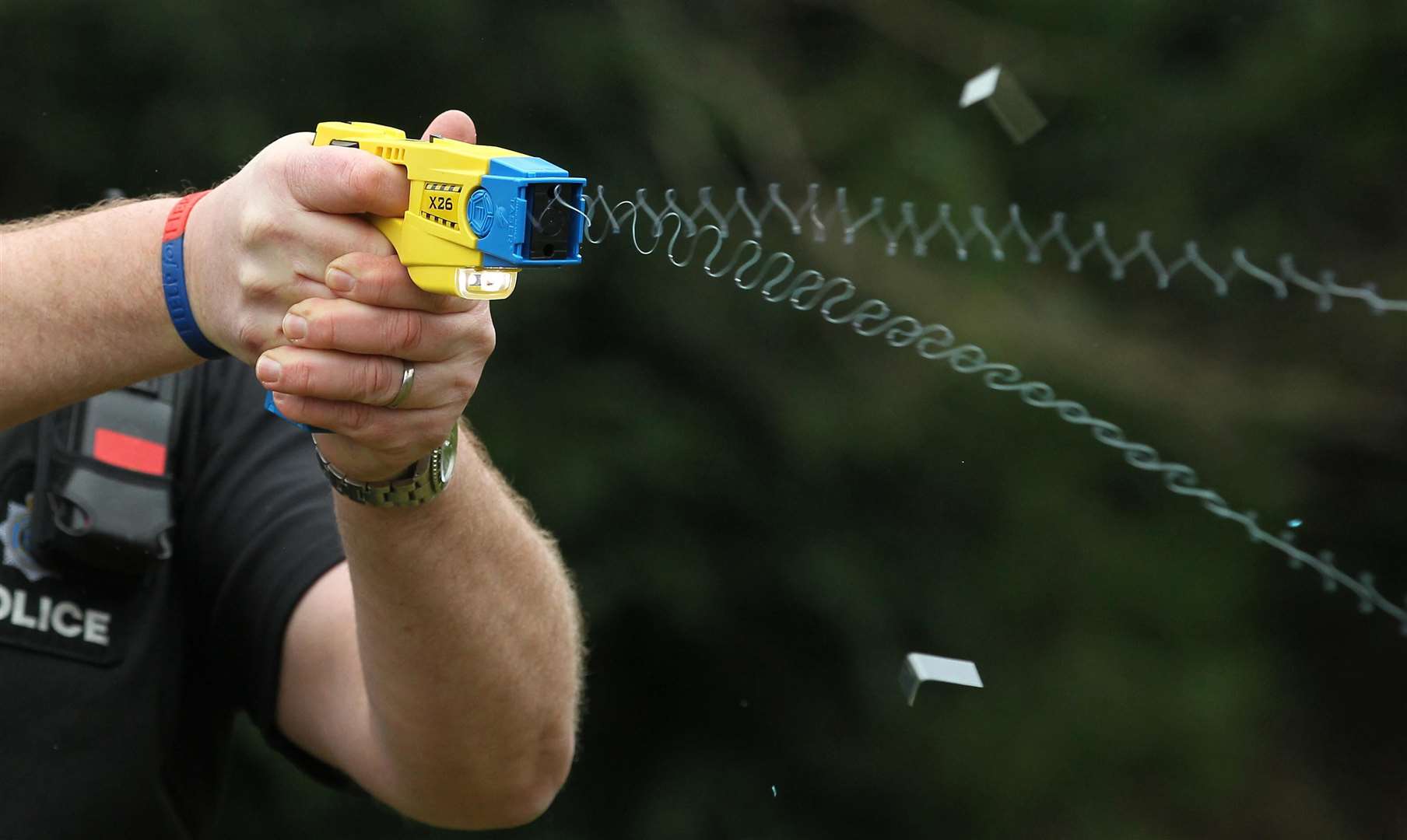 A police officer demonstrating the use of a Taser (PA)
