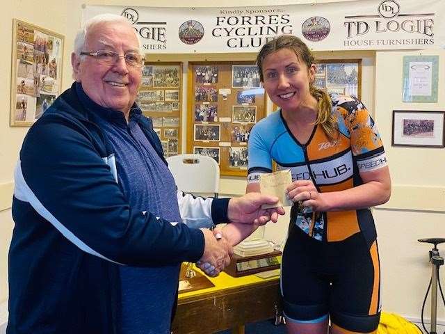 Peter Robertson of Forres CC presenting Debbie Greig a prize for the first female in the 10-mile TT.