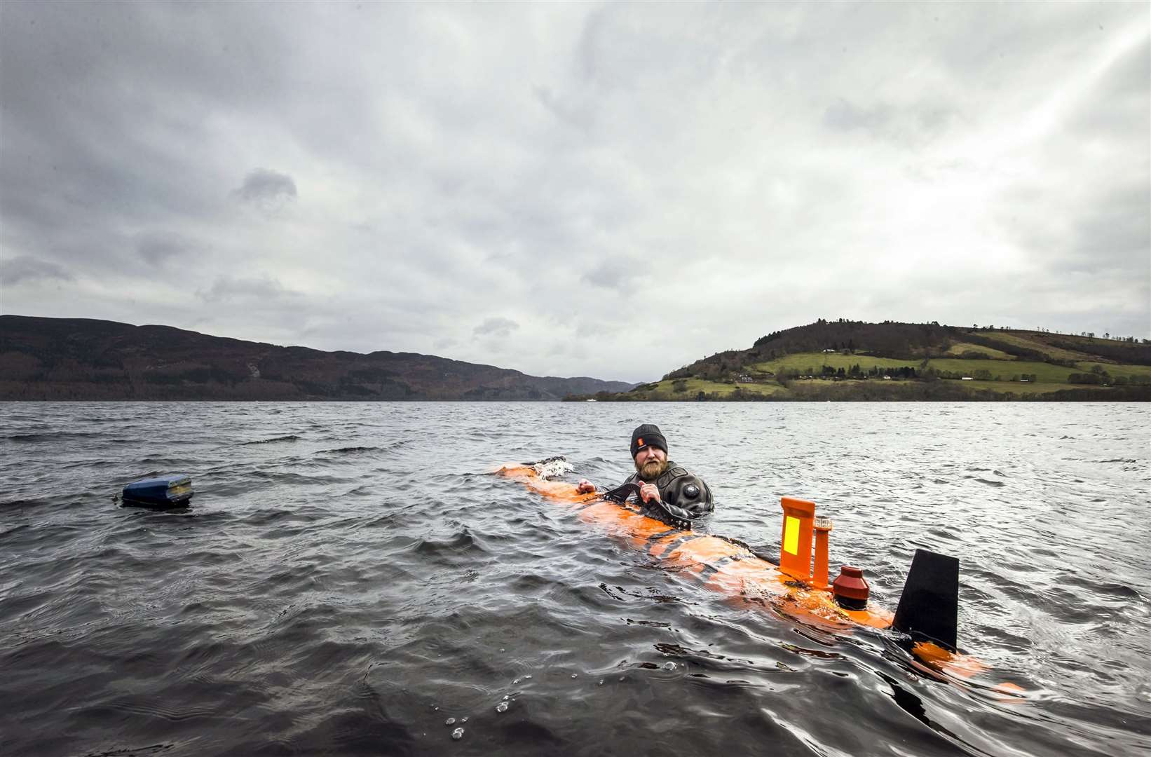 An engineer helps launch a search vessel at Loch Ness (Danny Lawson/PA)