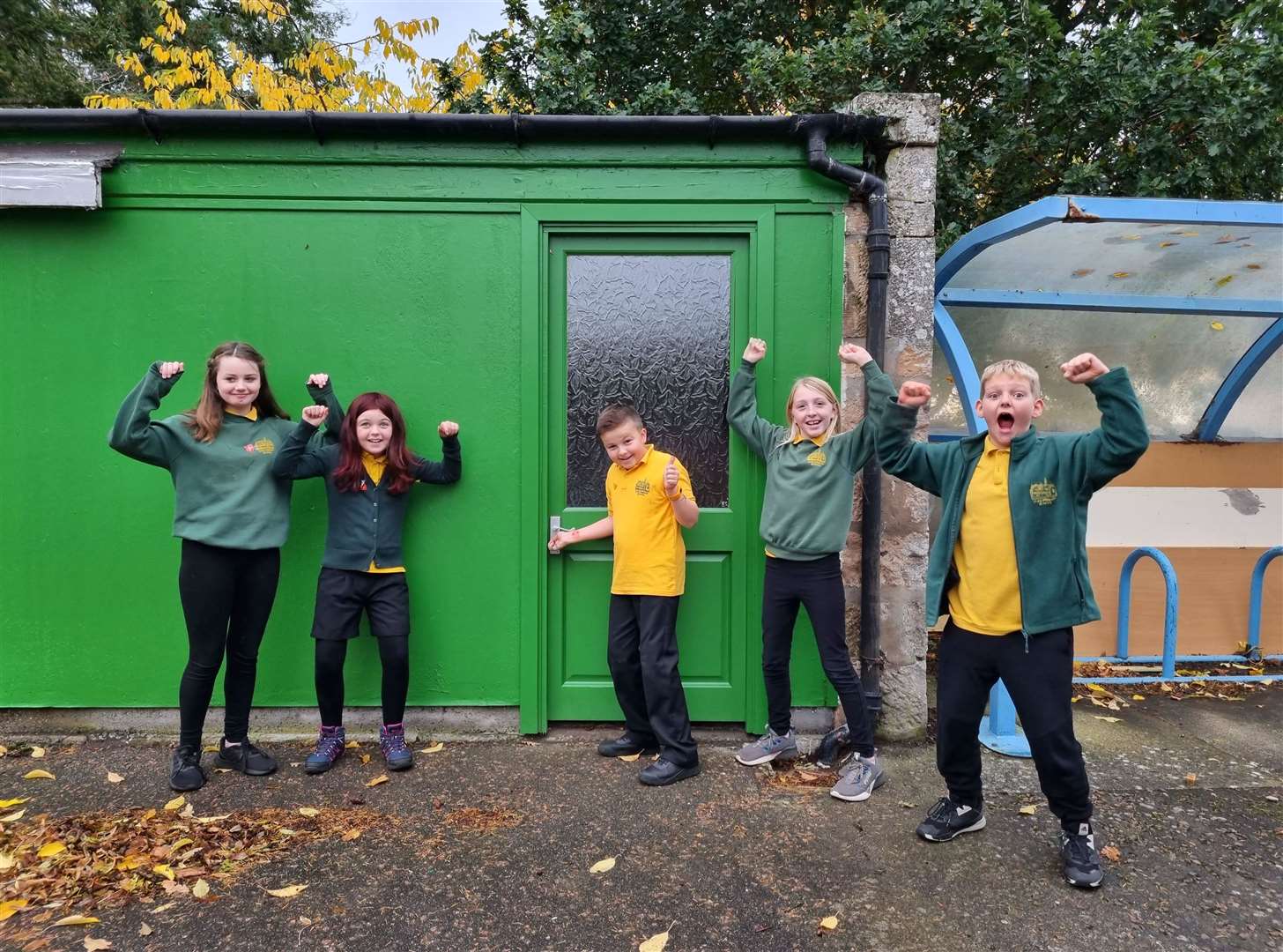 House and vice captains from Dyke Primary School proudly showing off their new uniform store.