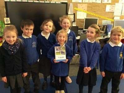 Cooking up a treat. Logie Primary P1 pupils Chloe, Charlie, Ellie, Rosie (front), Tamsin, Greta and Ossian proudly show off a copy of The Logie 100 .