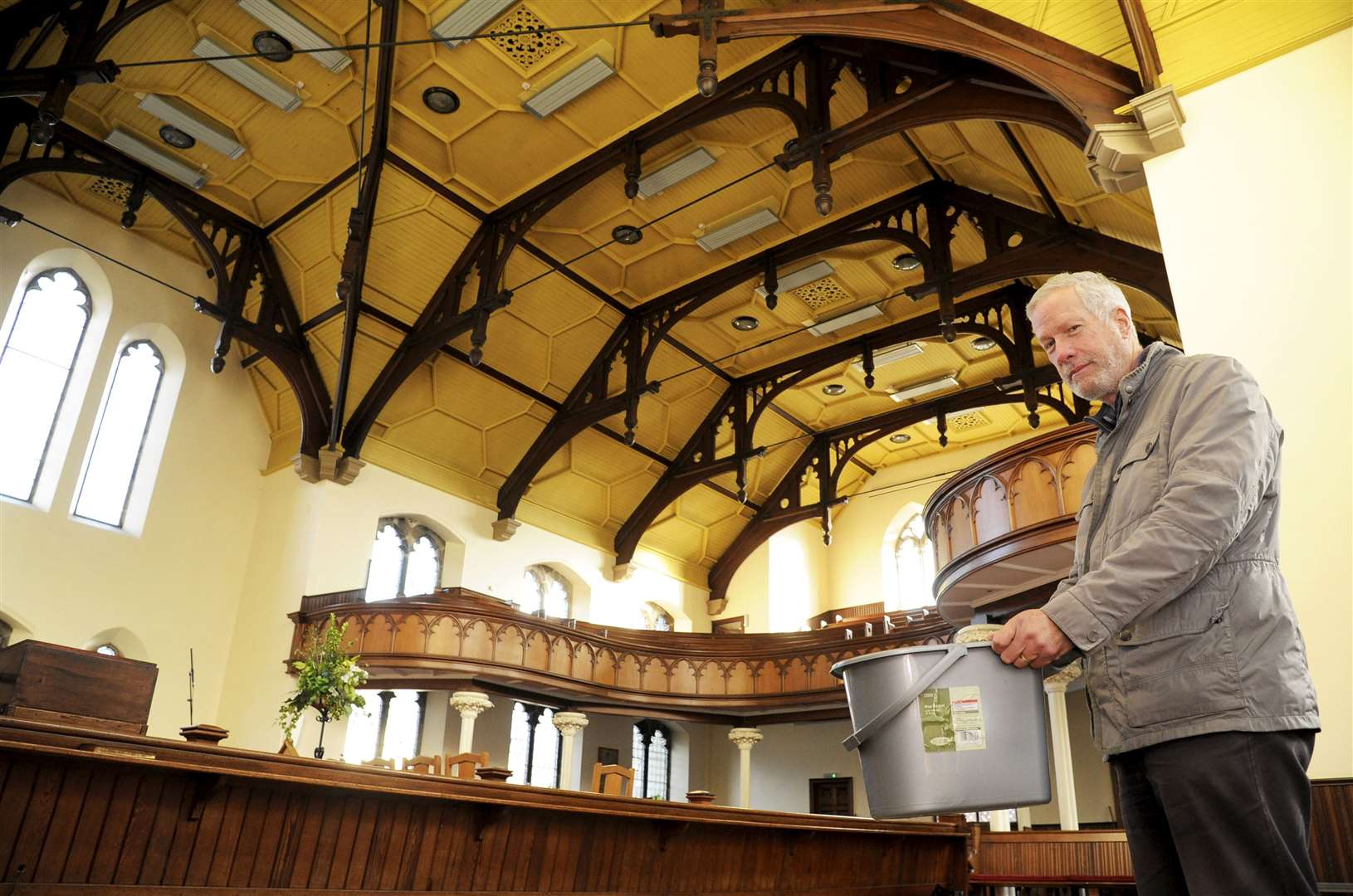 Roy Anderson coping with the leaking roof at St Leonard's Church.