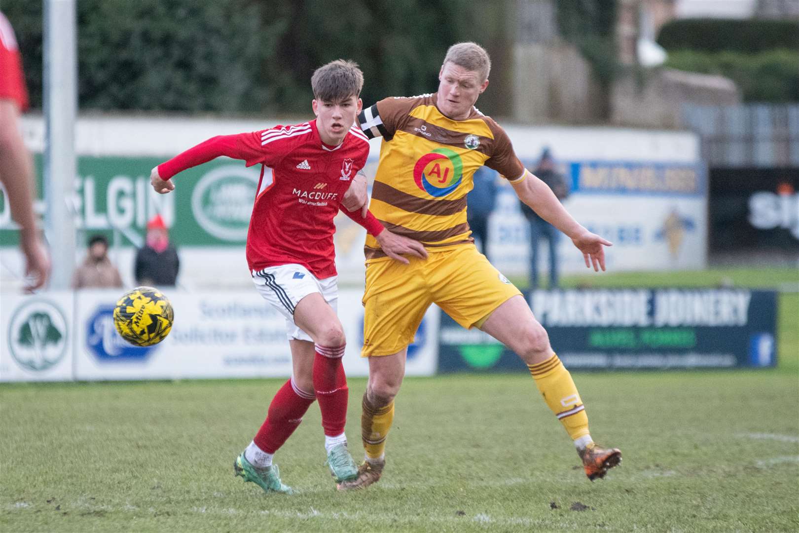 Vale's Jack Mitchell and Forres' Lee Fraser compete for the ball...Forres Mechanics FC (0) vs Deveronvale FC (2) - Highland Football League 23/24 - Mosset Park, Forres 13/01/2024...Picture: Daniel Forsyth..