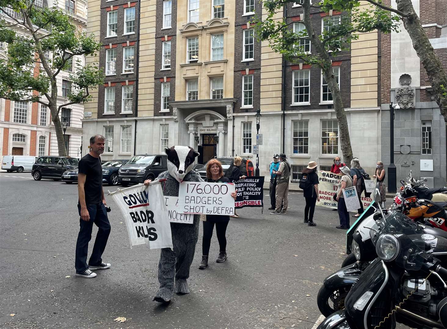 Badger cull protesters outside the Tory leadership hustings event (Sophie Wingate/PA)