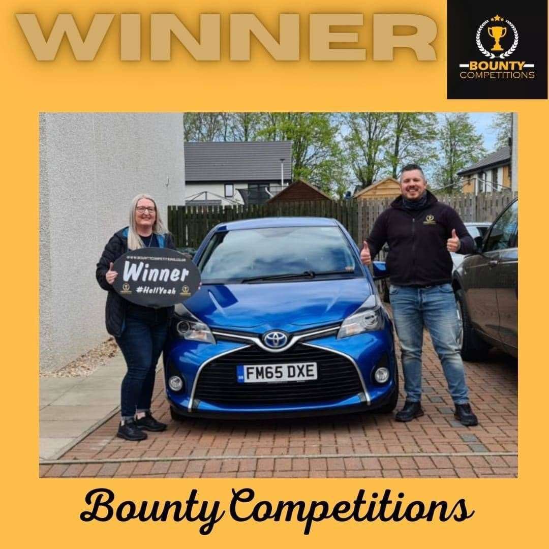 Amanda receiving the car from Bounty Competitions.