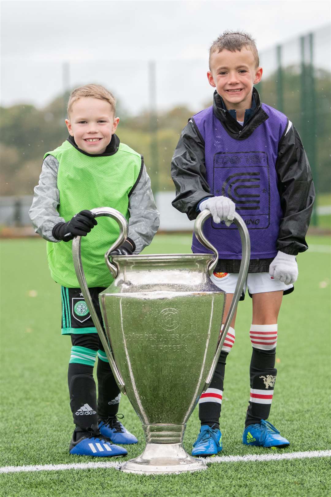 Liam Brander (left) and Jack Robertson with the UEFA Champions League trophy. Benfica won the UCL in 1961 and 1962. ..SL Benfica coaching and training held at Elgin's Gleaner Arena...Picture: Daniel Forsyth..