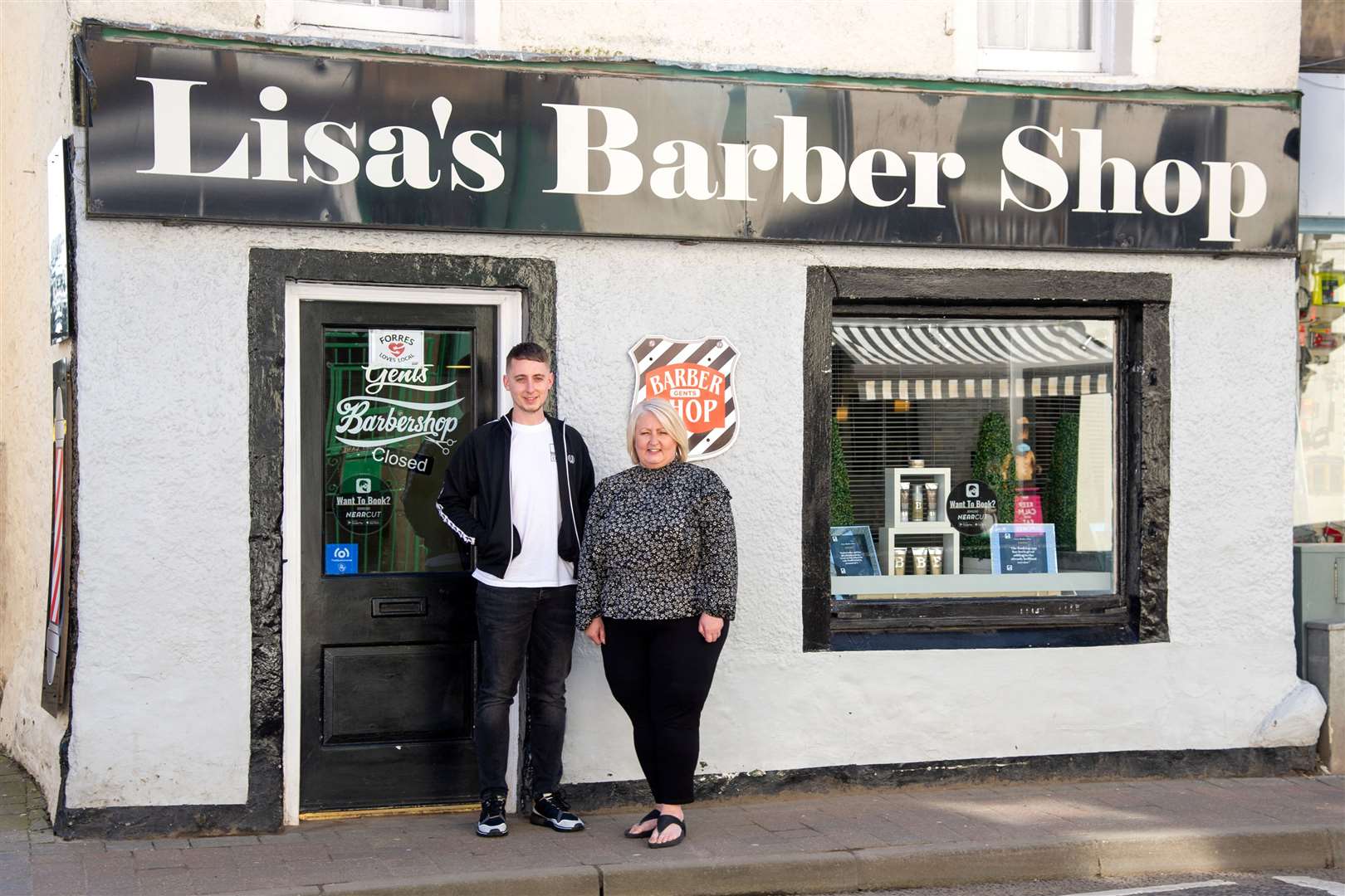 Lisa and Mark Savage are glad to be back working at Lisa's Barber Shop.