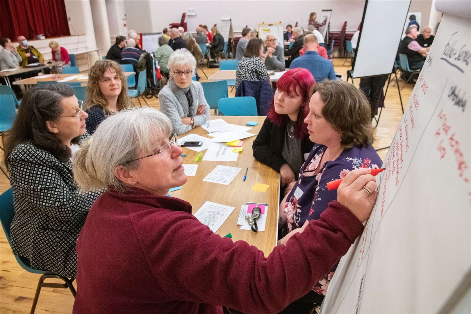FACT project officer Lorretta Oliphant noting the ideas and suggestions provided by a random group of attendees at the town hall. Picture: Daniel Forsyth