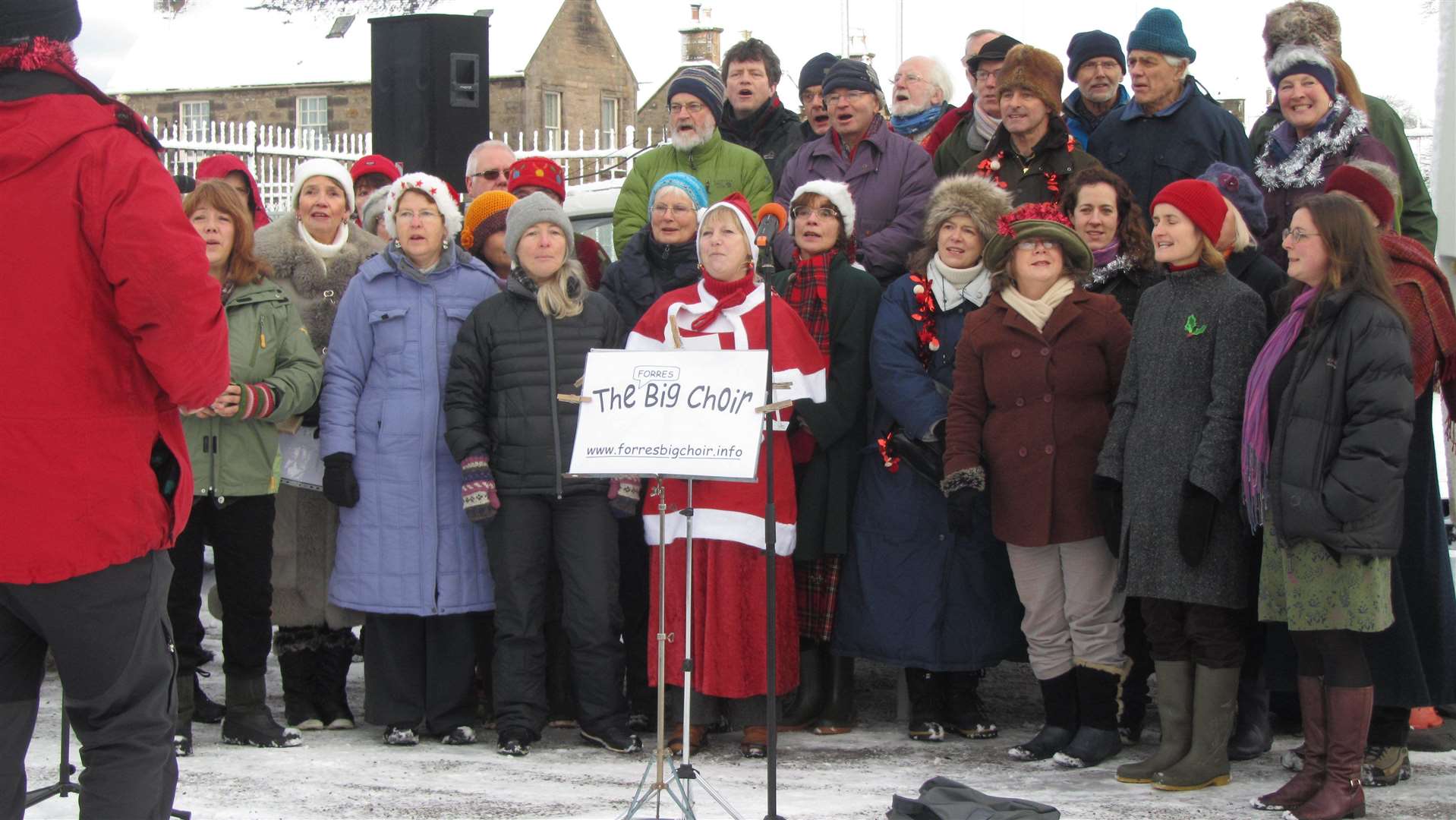 Singing seasonal songs outside Anderson's Primary to support the Christmas Market in December 2012.