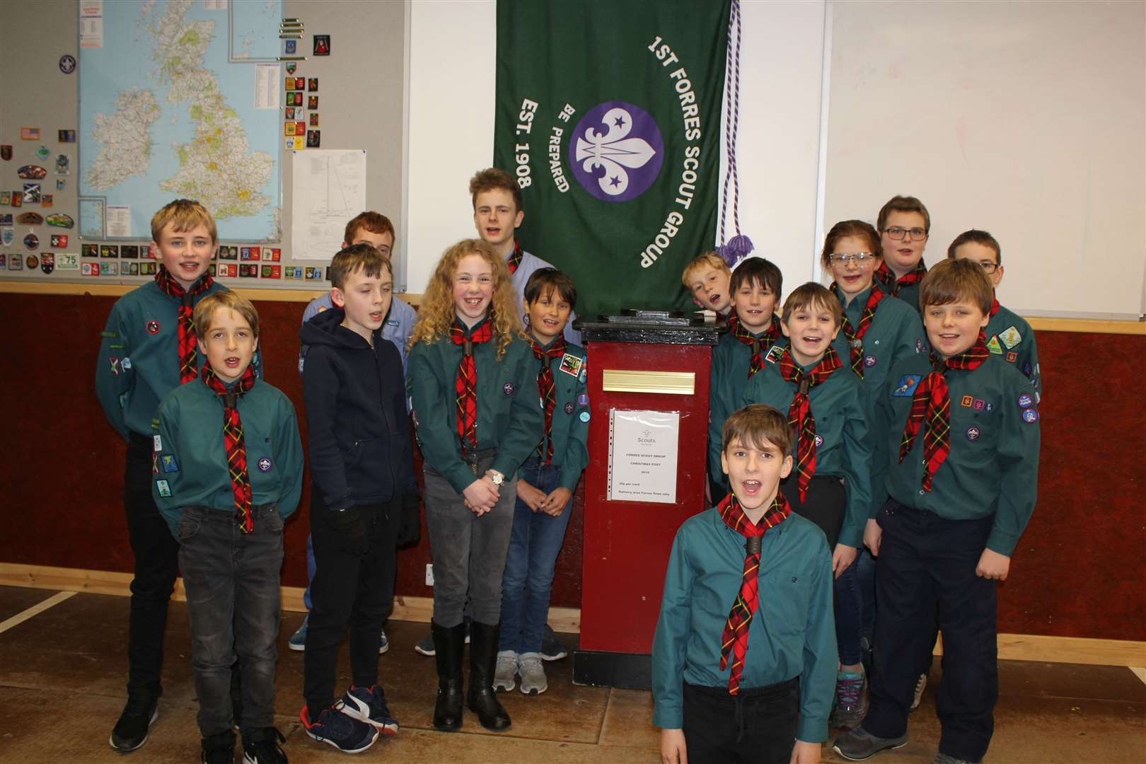 Forres Scouts with one of their Christmas post boxes.