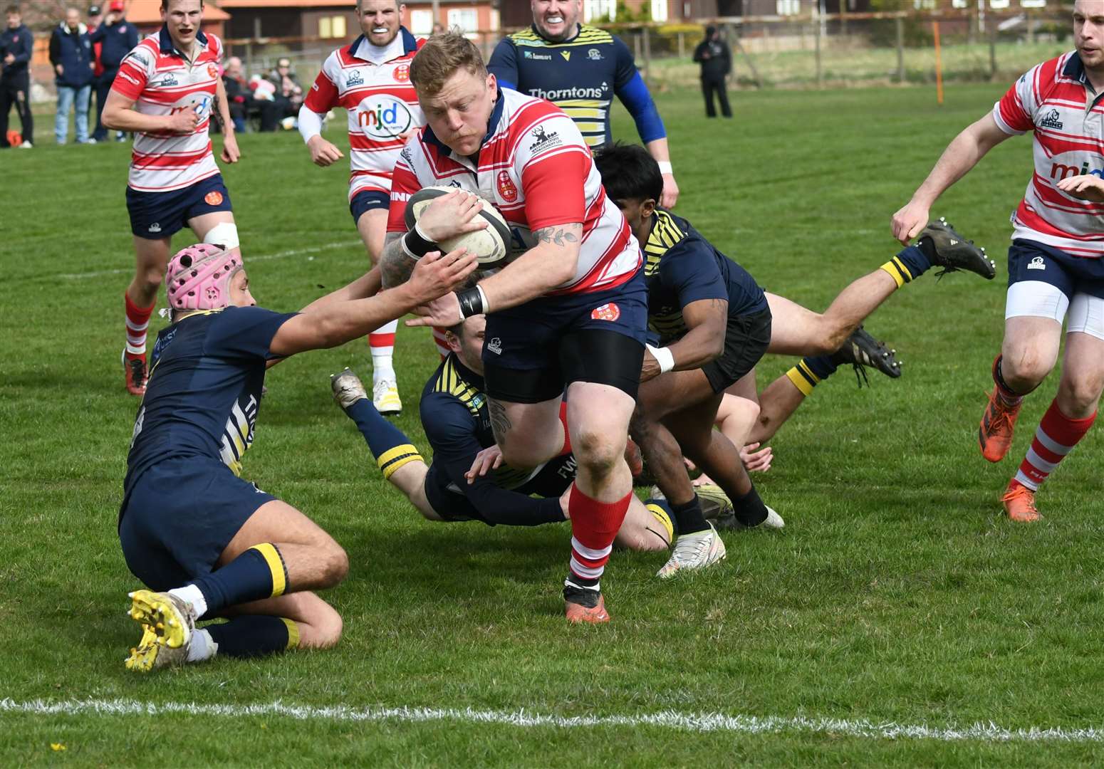 Lewis Scott breaks tackle to score his first try. Picture: James Officer