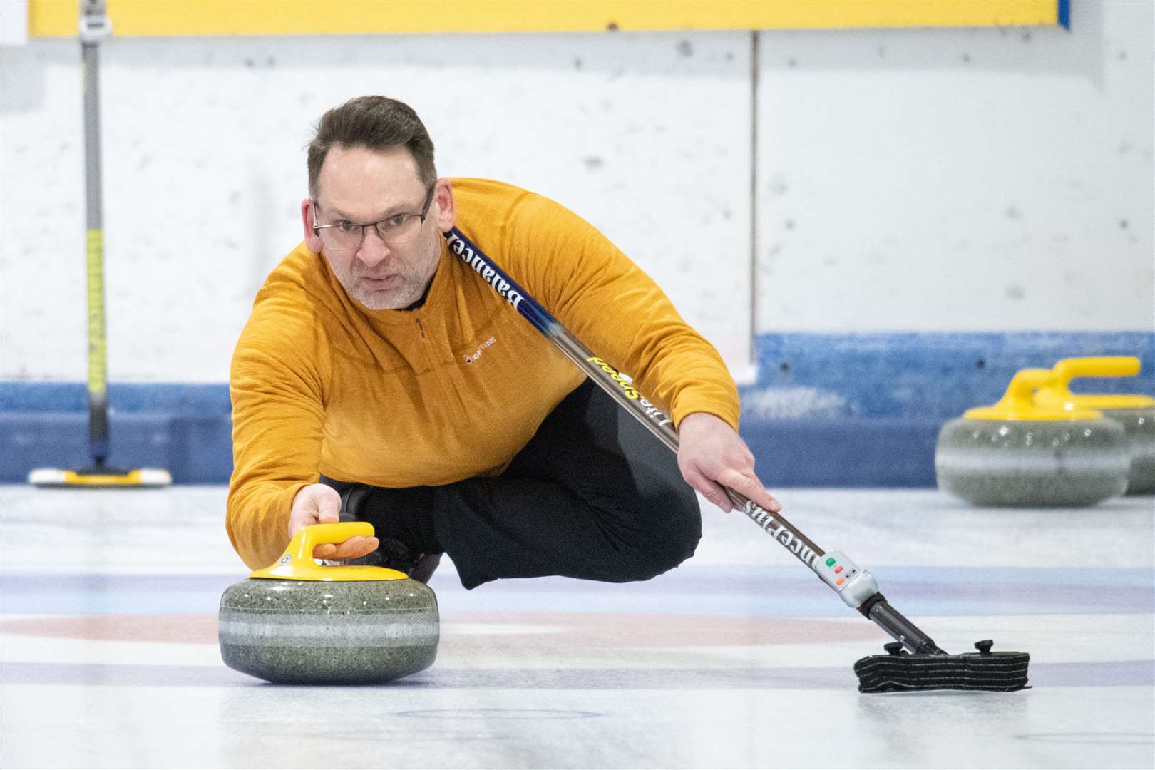 Moray curler Kenny Oswald guides his stone towards the house. Picture: Daniel Forsyth..