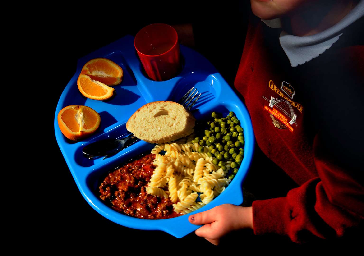 Households in England receiving Universal Credit must earn below £7,400 a year before benefits and after tax to qualify for free school meals (Anthony Devlin/PA)