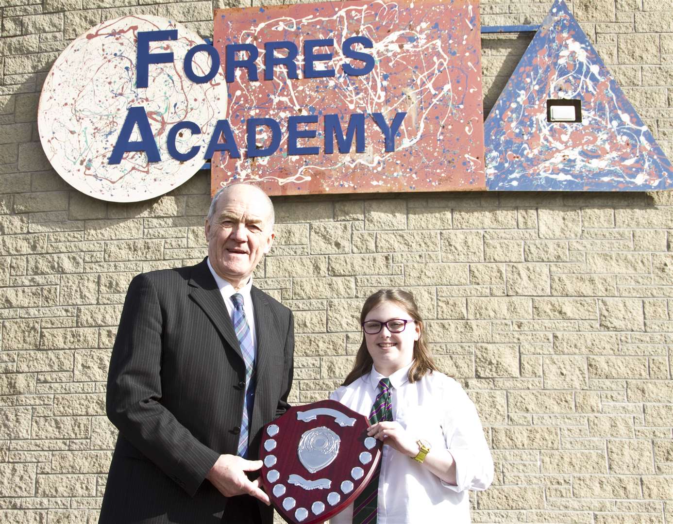 S5 pupil Kerry Niven-Gordon was presented with the Community Shield by George Alexander of Youth Concert organisers Forres Community Activities Association.