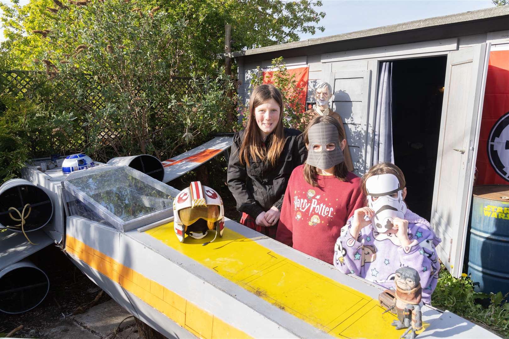 Caitlin Riddell, Sofia Haytack and Maisie Haytack checking out the X-wing Starfighter.
