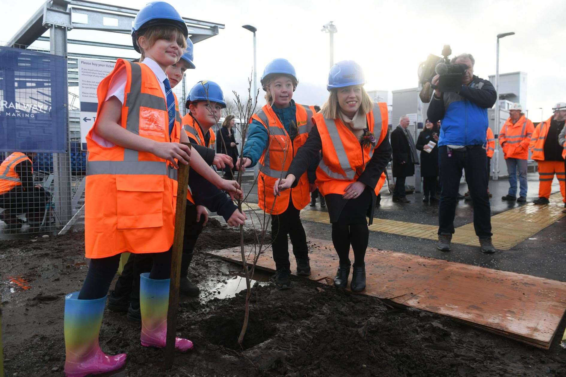 Planting a tree at the new station. Picture: James Mackenzie.