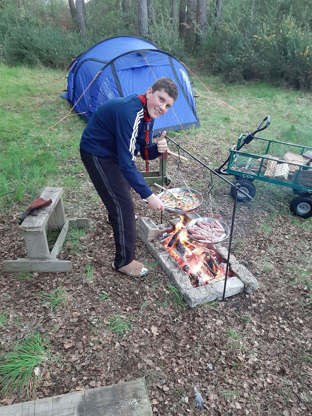 Marcus McEwan (12) camped in his garden and cooked his supper over an open fire.