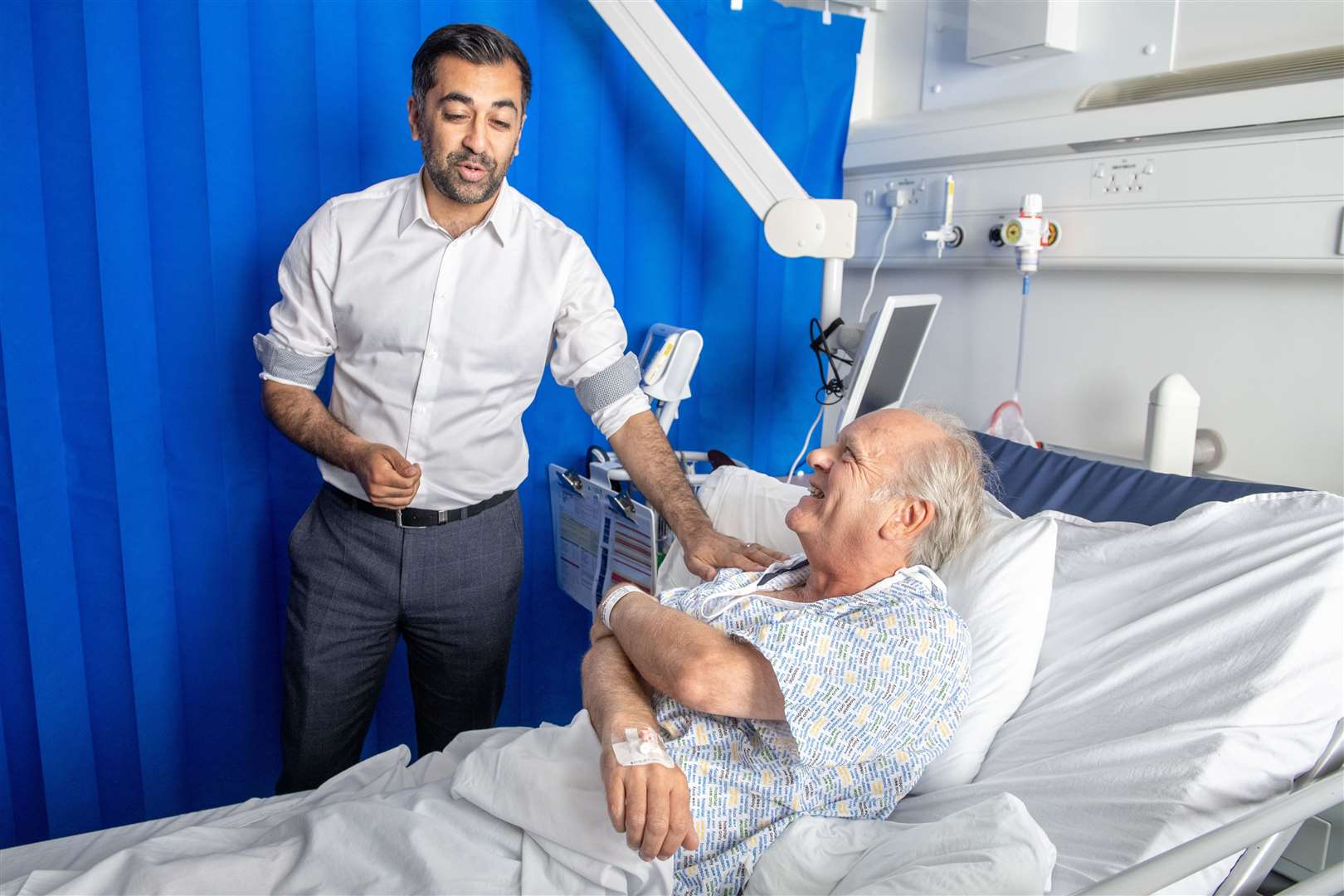 First Minister Humza Yousaf meets patient Paul MacIntosh during a visit to NHS Forth Valley Royal Hospital in Larbert (Lesley Martin/PA)