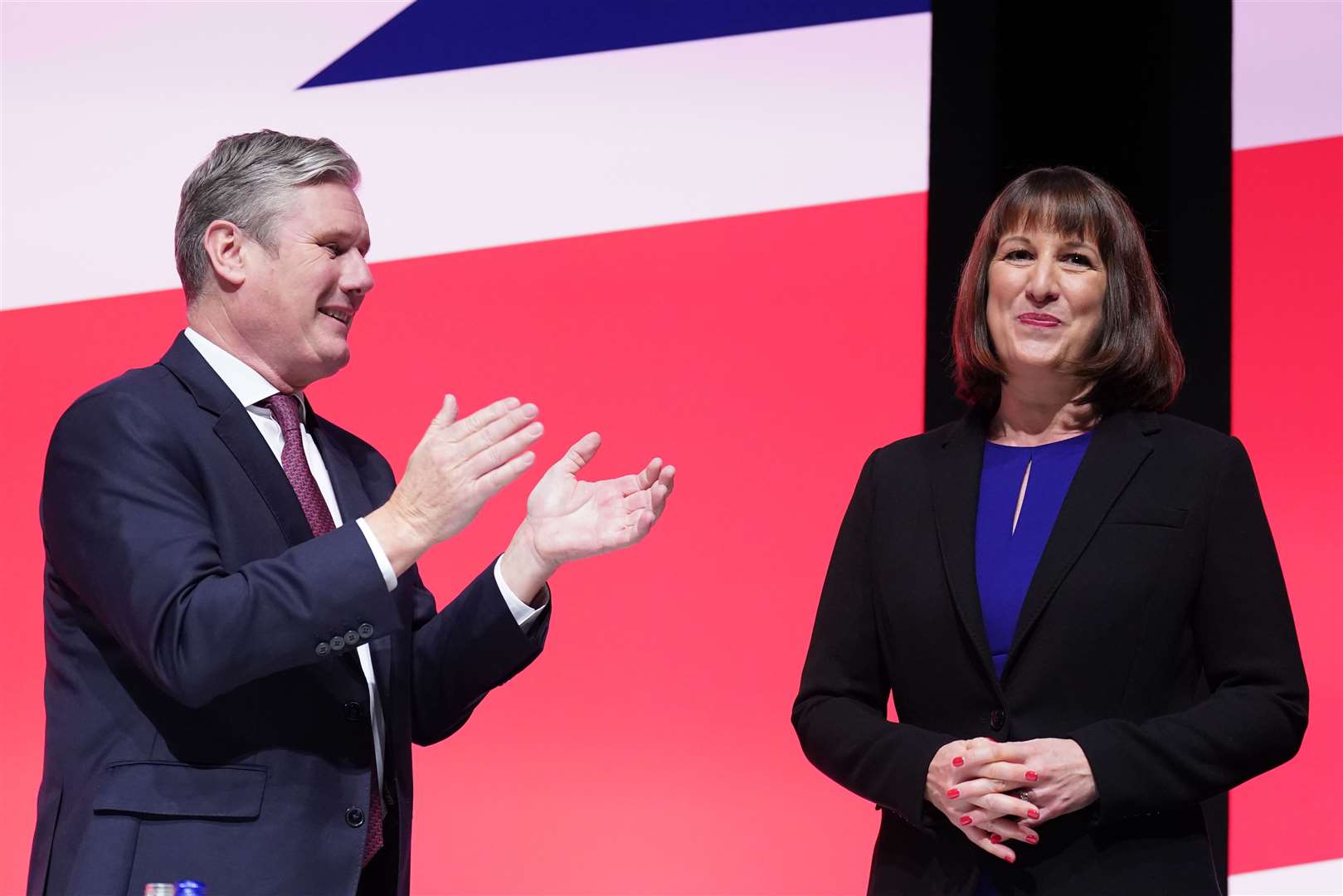 Party leader Sir Keir Starmer applauds shadow chancellor Rachel Reeves at the end of her keynote speech during the Labour Party conference (Stefan Rousseau/PA)