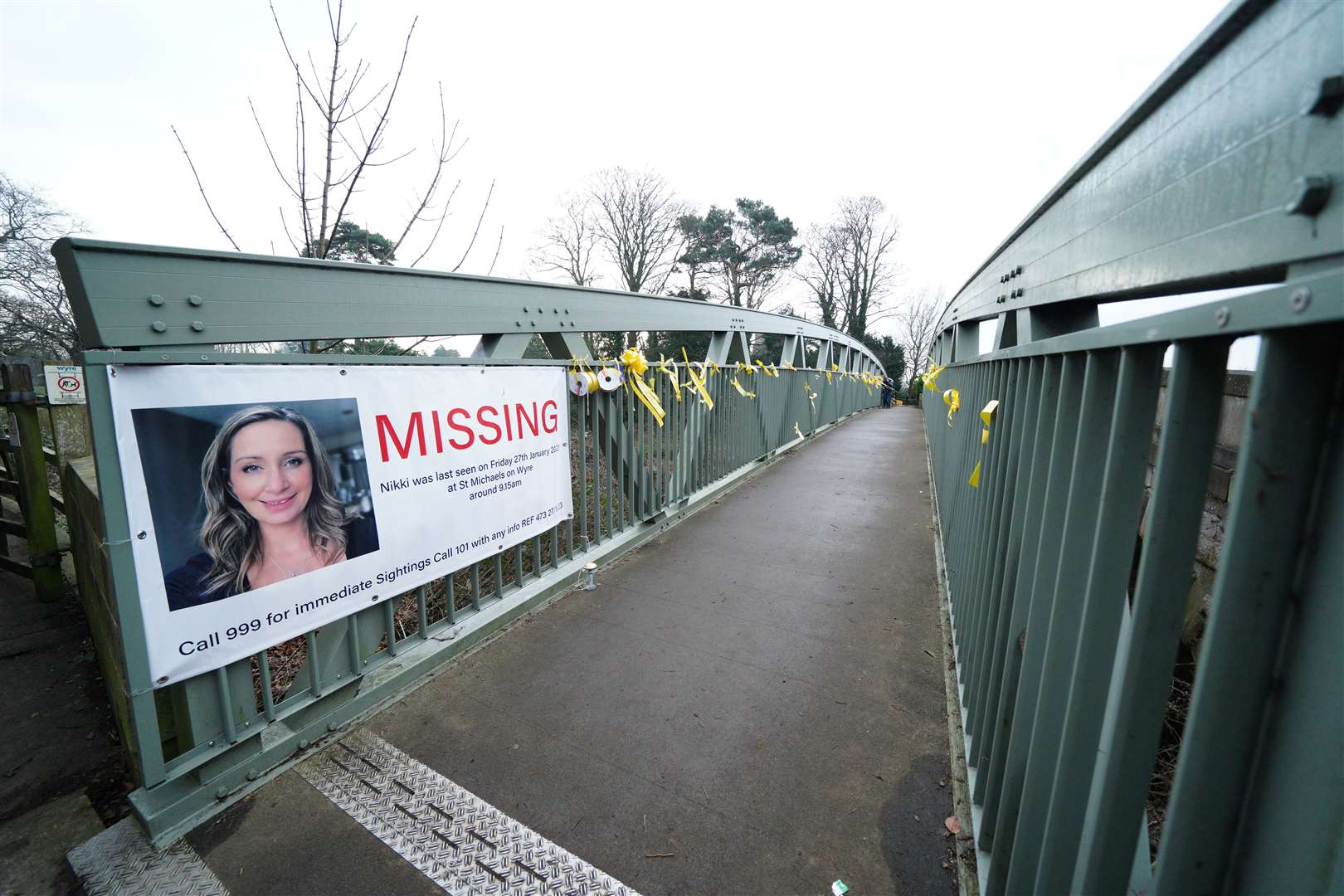 A missing person poster and yellow ribbons with message of hope for Nicola Bulley on a bridge over the River Wyre in St Michael’s on Wyre, Lancashire (Peter Byrne/PA)
