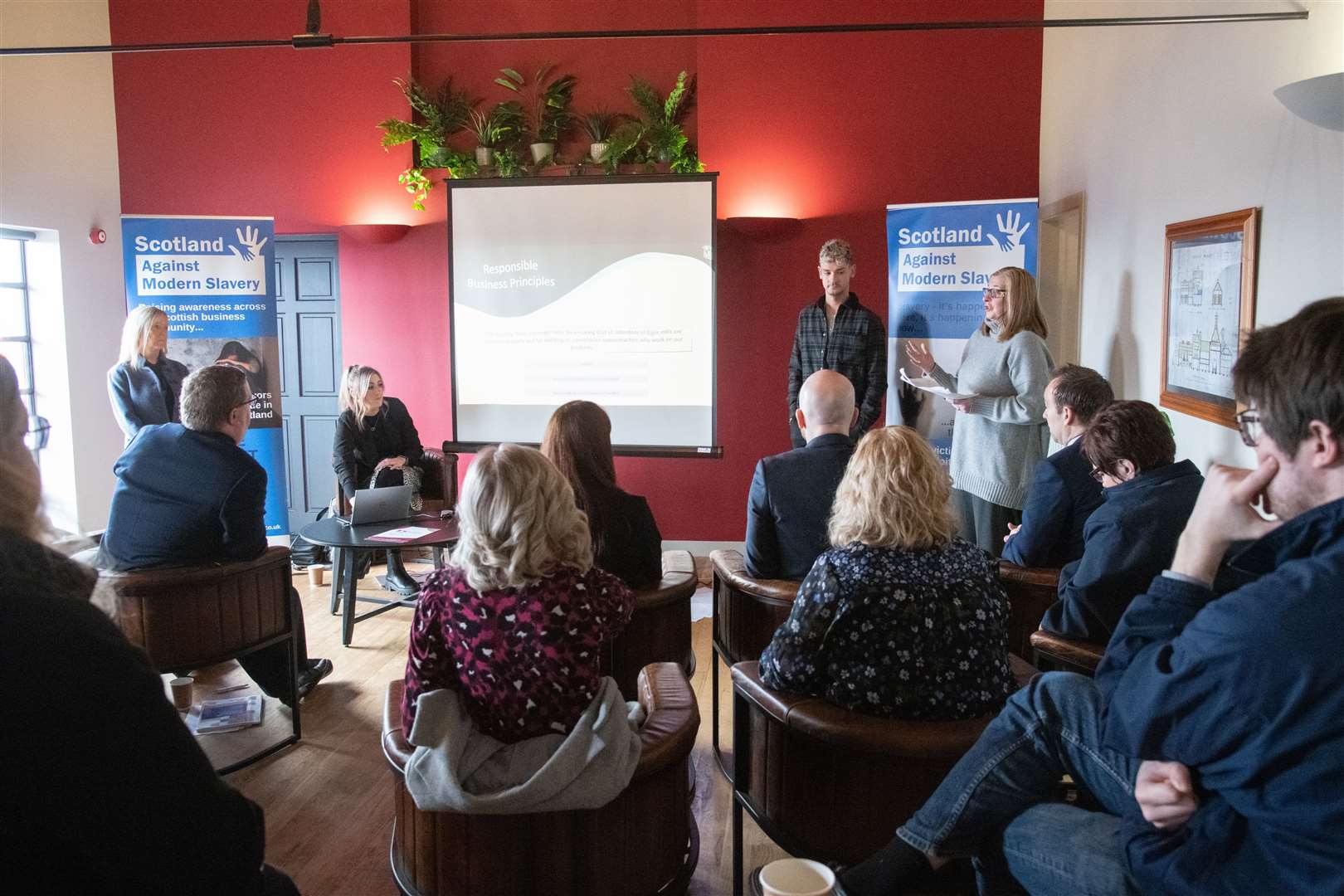 Staff from Johnstons of Elgin talk at the event. ..Scotland Against Modern Slavery hold an event, with Moray Chamber of Commerce, at Benromach Distillery, Forres. ..Picture: Daniel Forsyth..
