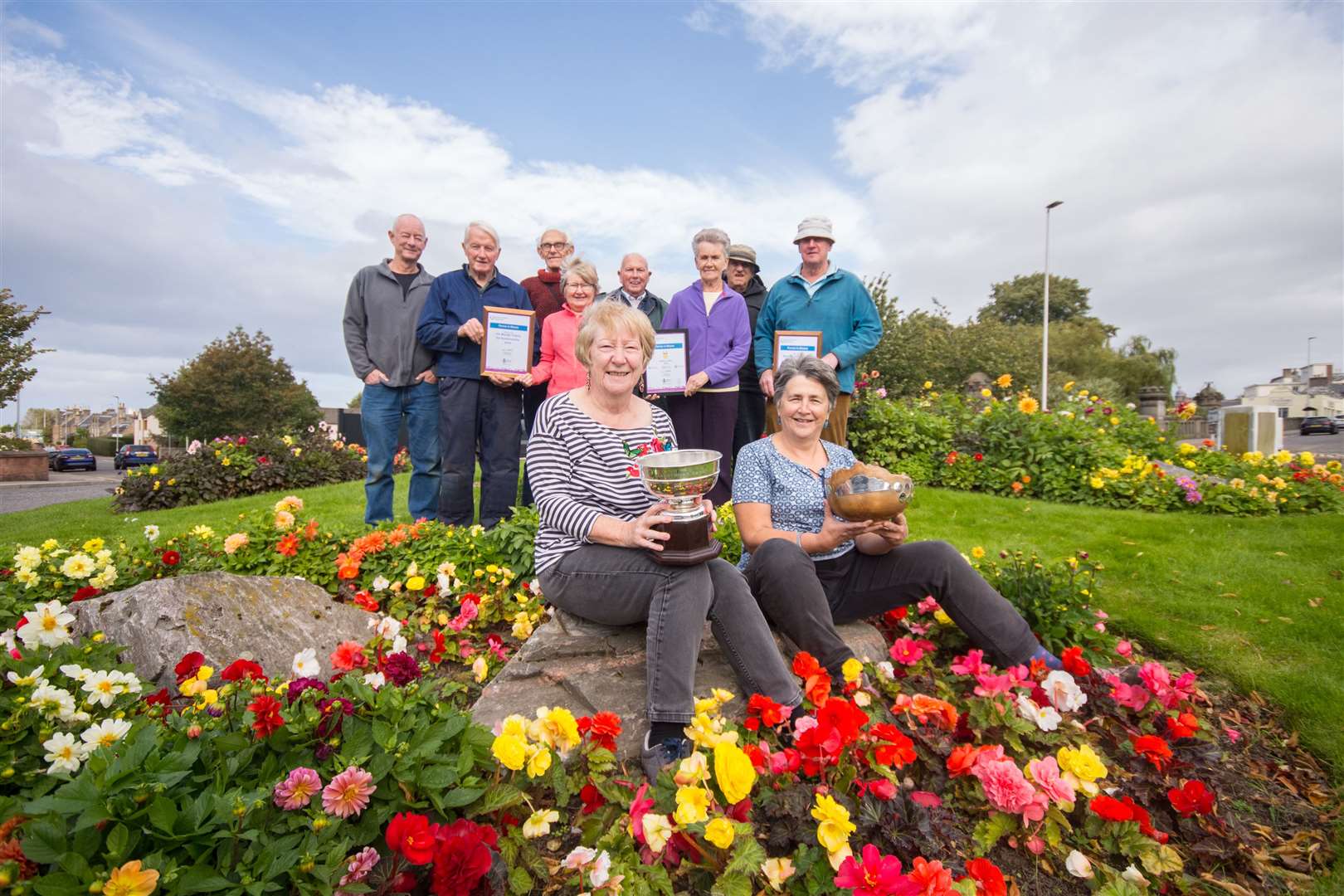 Forres in Bloom secretary Sandra Maclennan (left) and chairwoman Diane McGregor (right) and some of the other volunteers with their Beautiful Scotland awards.