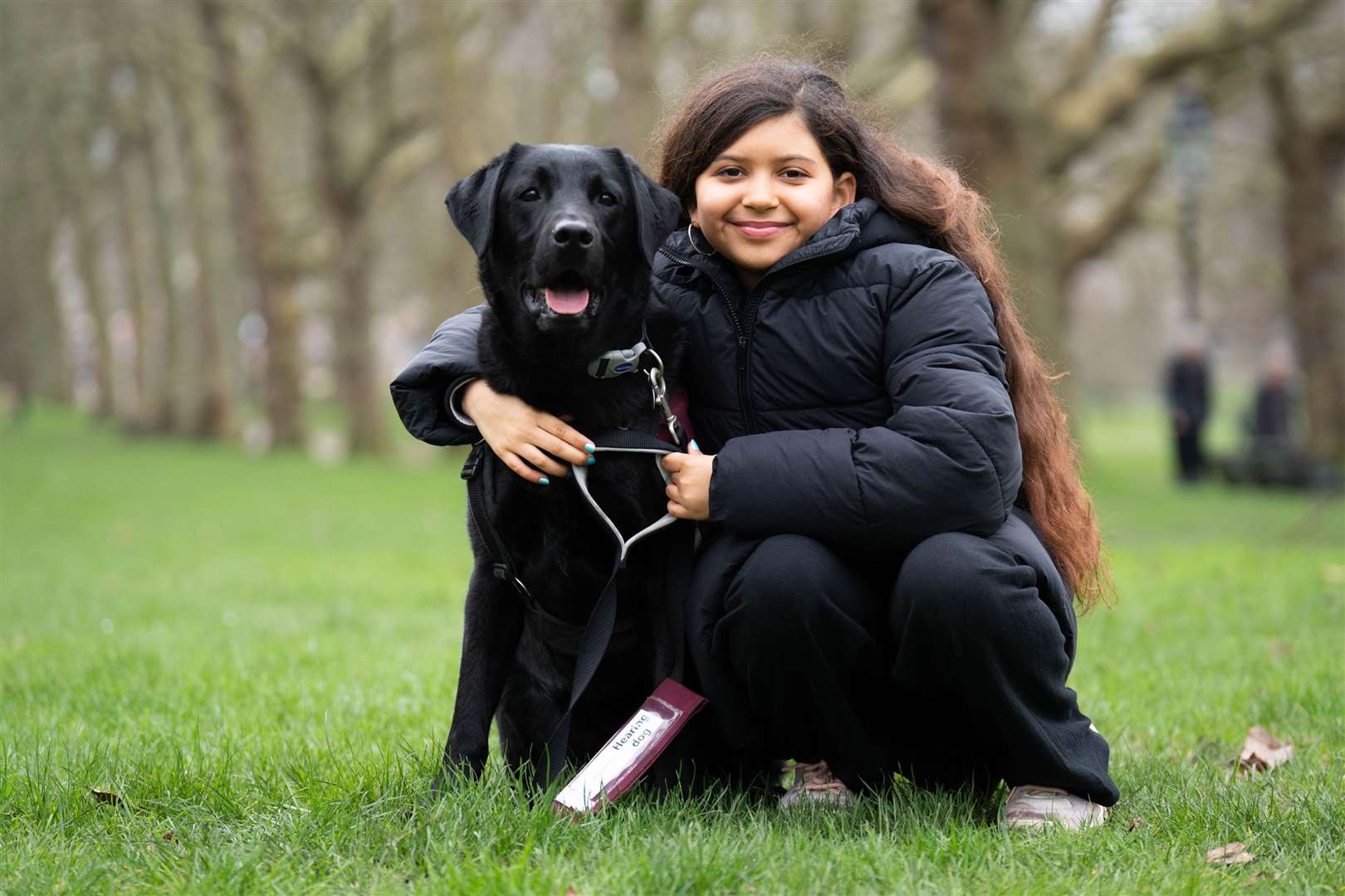 Hearing dog Gordon, with his owner Elyana Kuhlemeier (James Manning/PA)