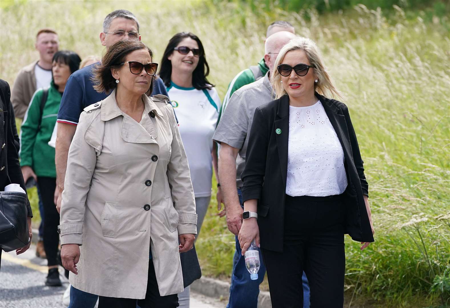 Sinn Fein president Mary Lou McDonald, left, and Michelle O’Neill walk towards Bodenstown cemetery, Co. Kildare (Brian Lawless/PA)