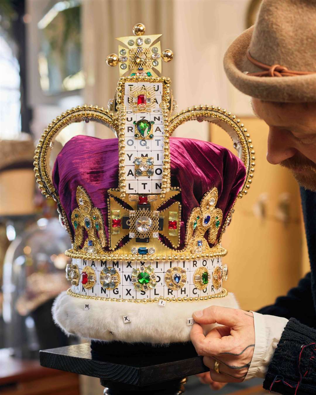 British milliner Justin Smith of J Smith Esquire poses with the crown he has made (Mattel/Michael Bowles)