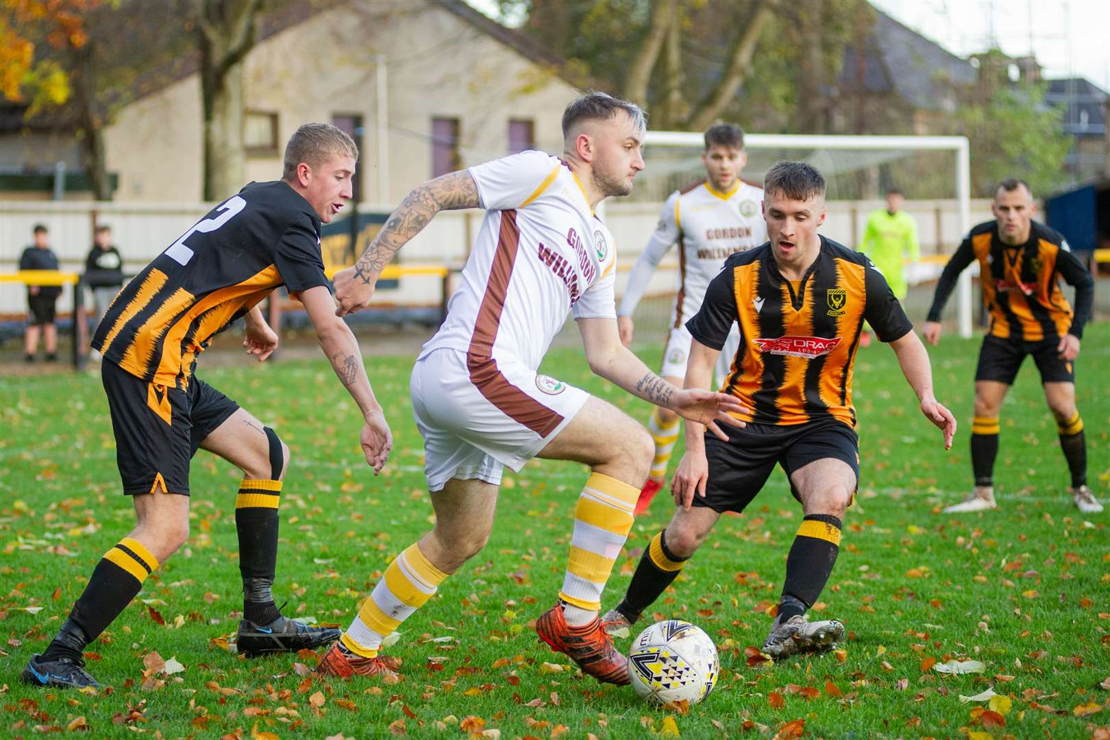 Forres Mechanics' Paul Brindle looks for a way past the home defence. Picture: Daniel Forsyth..
