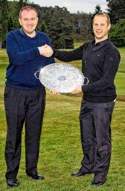 Presenting the Jubilee Tray to Stuart Maclennan (left), the winner of the 18-hole open competition at Forres Golf Club, is club captain Allan Martin.