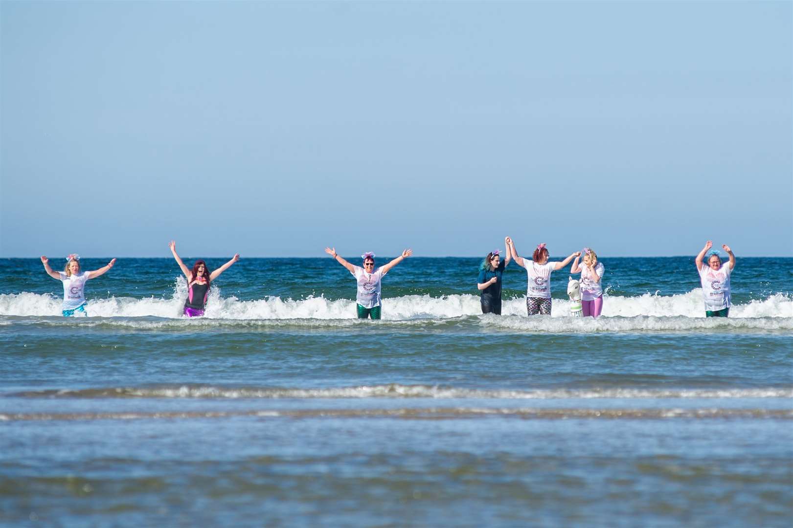 The R-evolution For Good team in the sea after performing a dance to the song 'Under the Sea' for their Kiltwalk challenge at Findhorn. Picture: Daniel Forsyth.