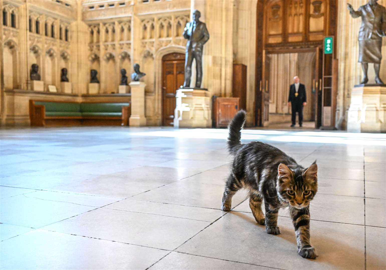 Attlee walks across Members’ Lobby in front of a statue of his namesake, former Labour prime minister Clement Attlee (Jessica Taylor/UK Parliament/PA)