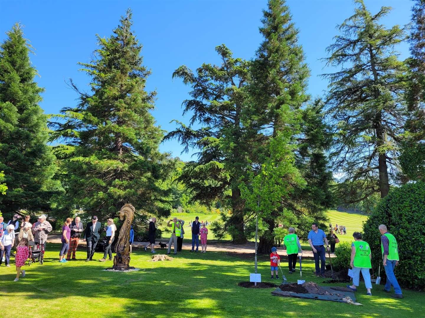 The crowd dispersing after the unicorn unveiling and ceremonial tree planting at the Picnic in the Park on Sunday.