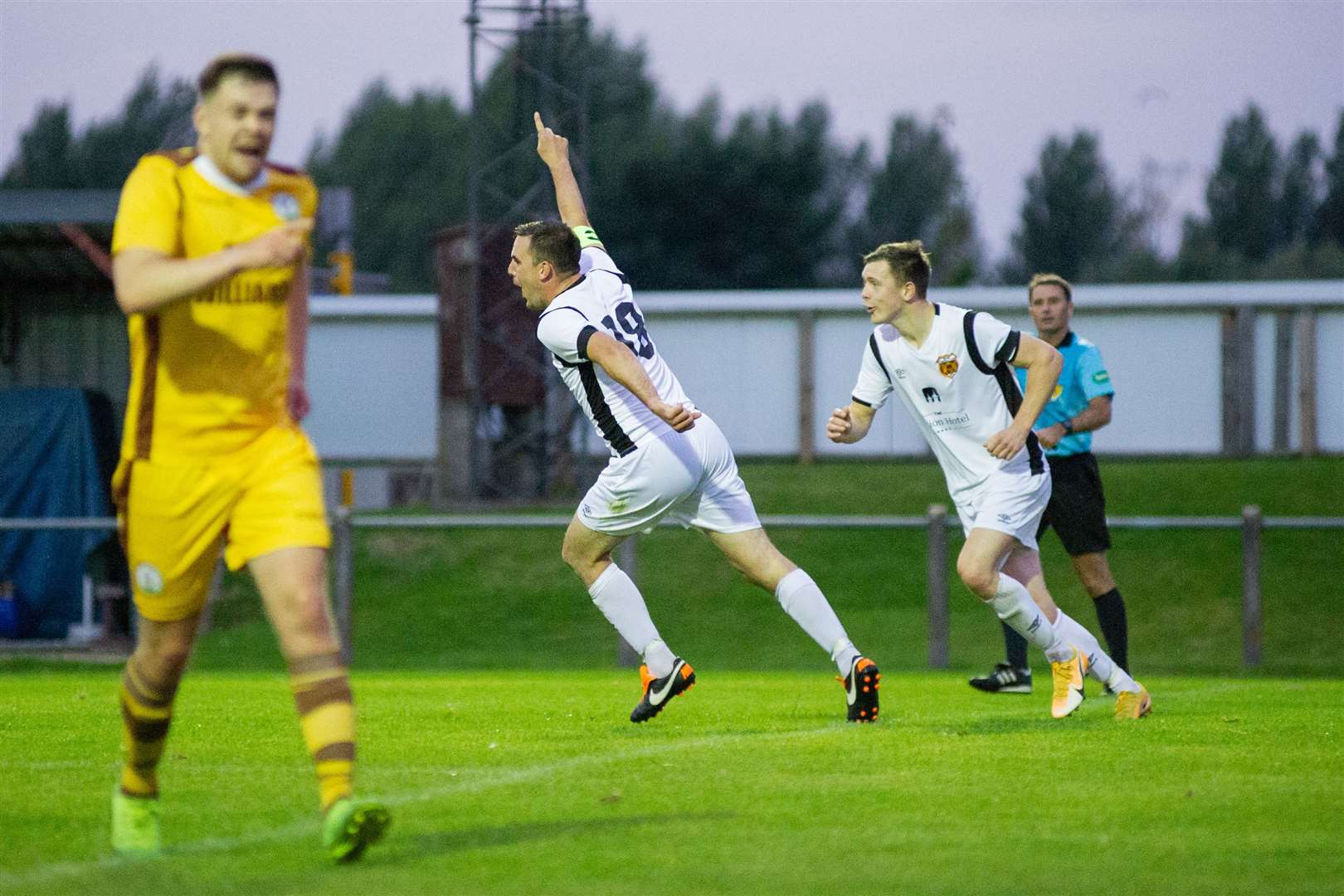 Speysiders' captain Bruce Milne volleys home the final goal for the visitors. ..Forres Mechanics (0) vs Rothes FC (3) - North of Scotland Cup - Mosset Park, Forres 04/08/2021...Picture: Daniel Forsyth..