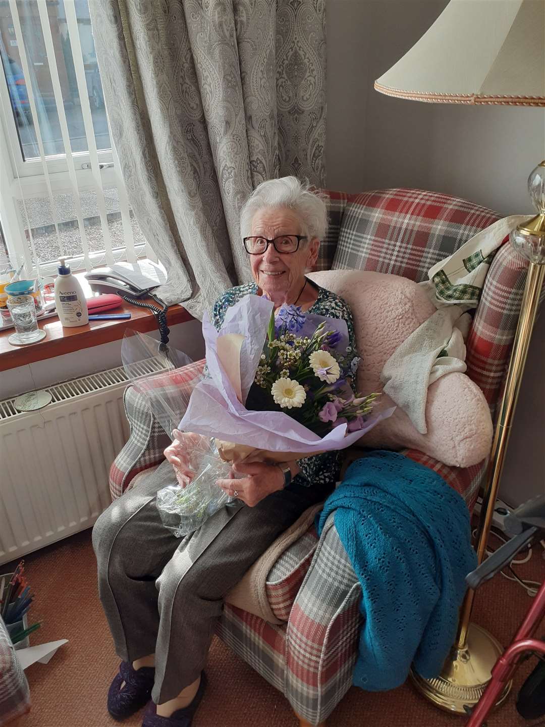 Joan with one of the birthday bouquets of flowers gifted to her by family and friends.