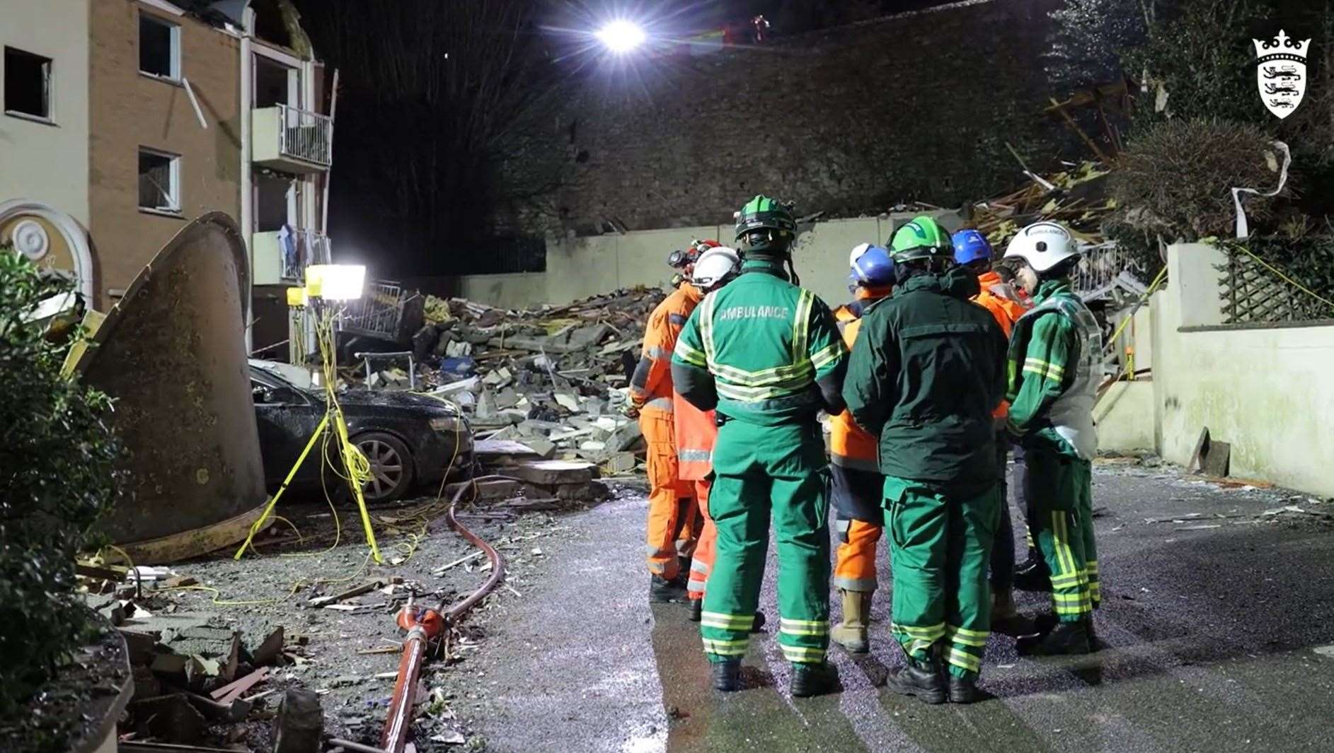Emergency services at the scene of the explosion and fire (Government of Jersey/PA)