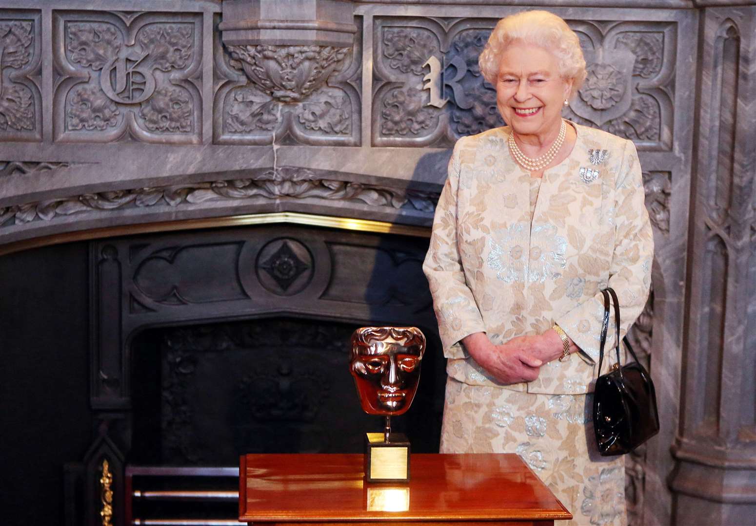 Queen Elizabeth II receives an honorary Bafta in recognition of a lifetime’s support of British film and television at Windsor Castle (Steve Parsons/PA)