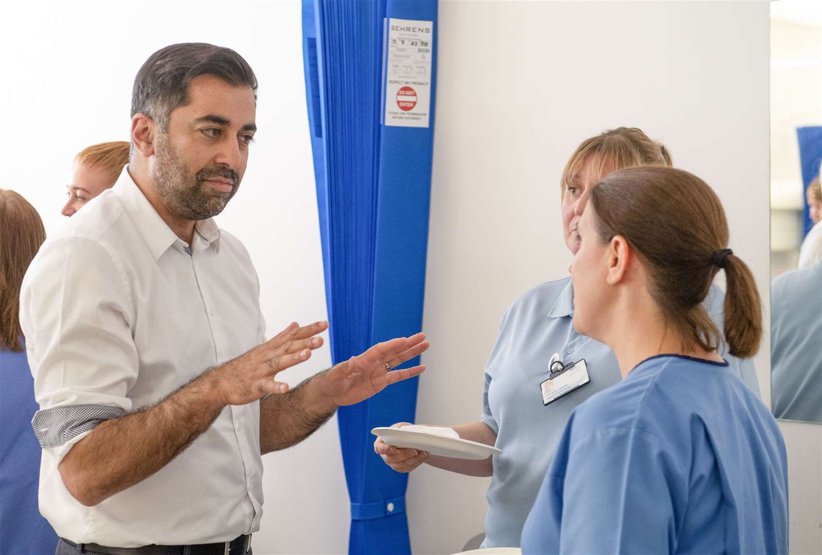 Humza Yousaf speaks to staff during his visit to NHS Forth Valley Royal Hospital (Lesley Martin/PA)