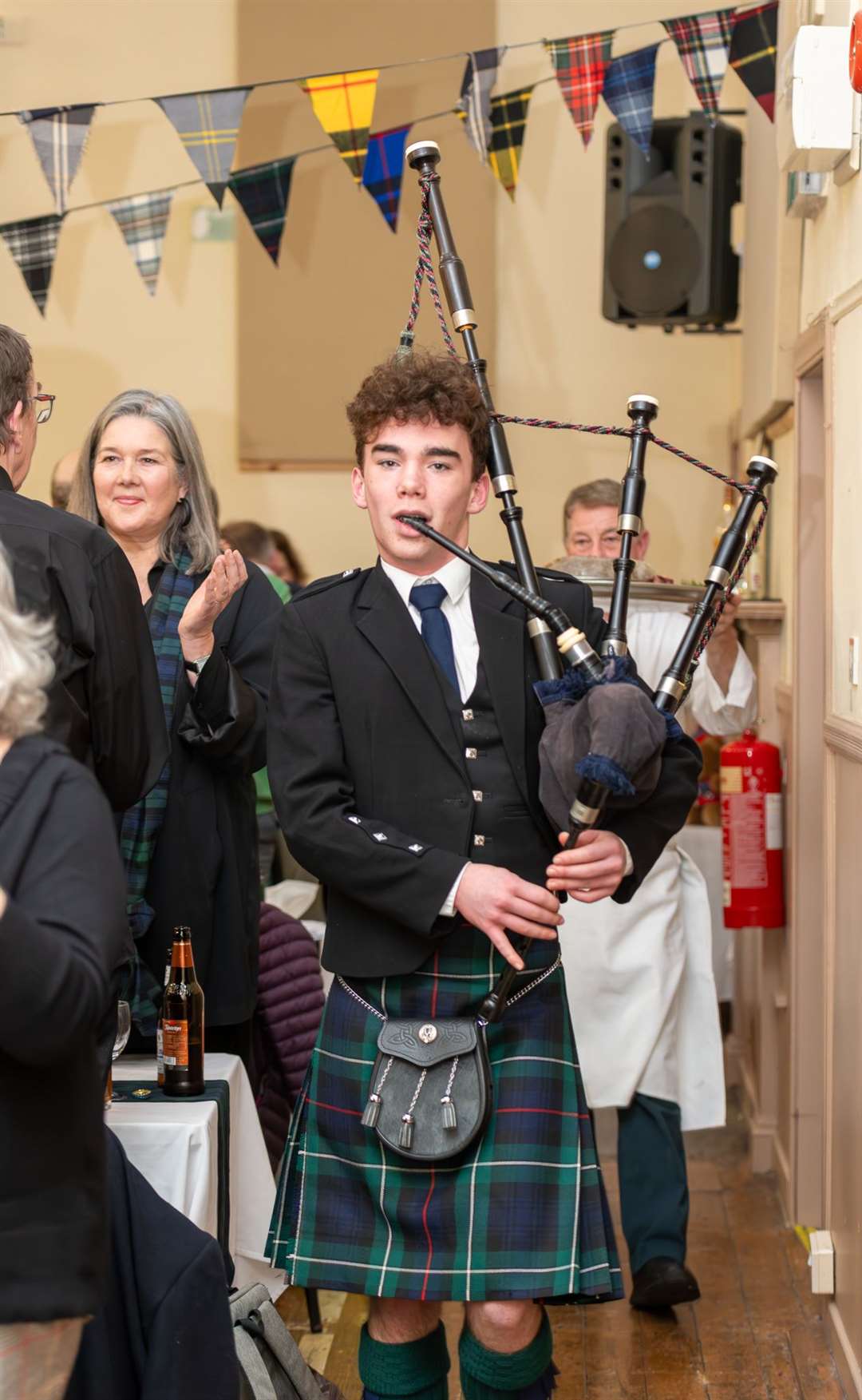 Piper Bill Symon leaving the hall after the address to the haggis. Picture by Morven Mackenzie