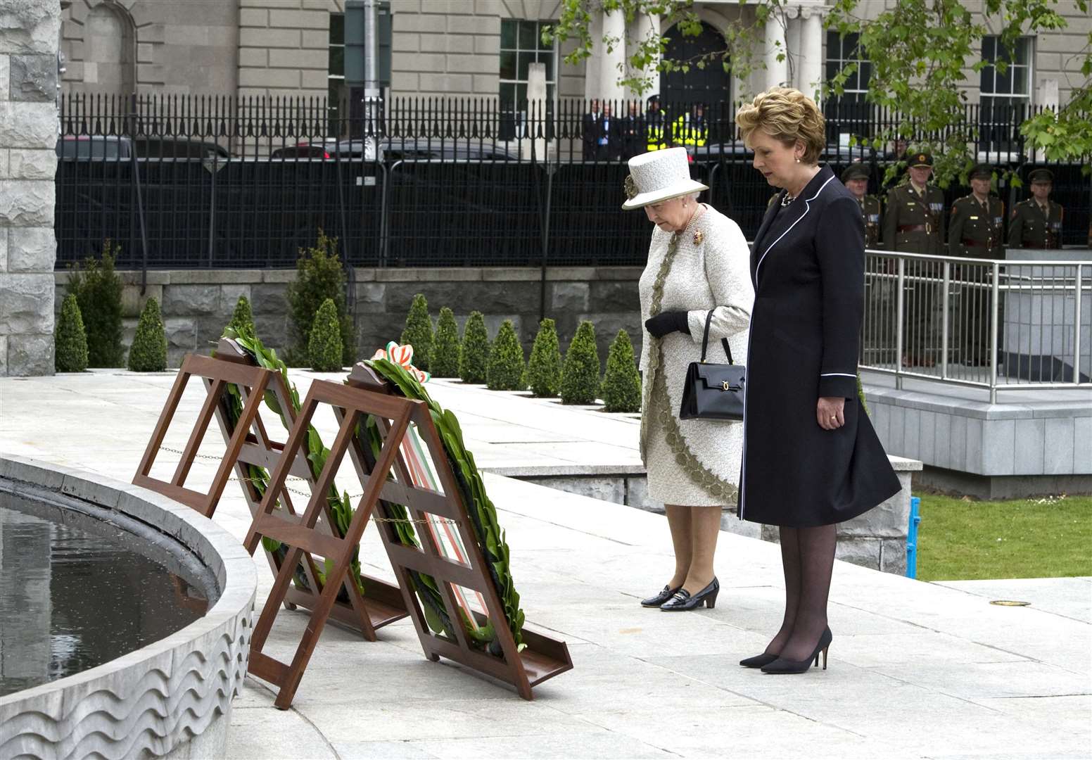 The Queen and President Mary McAleese pause for a moment after laying wreaths at the Garden of Remembrance (Maxwells/PA)