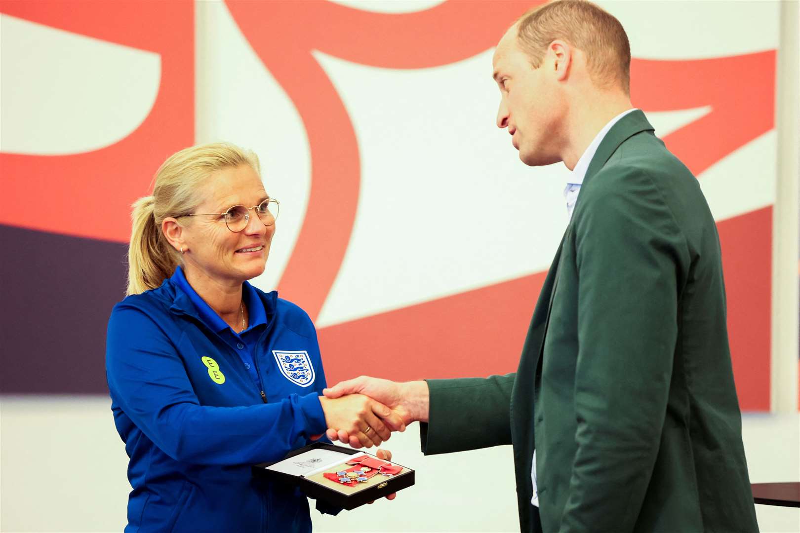 The Prince of Wales presents an honorary CBE to England manager Sarina Wiegman (Phil Noble/PA)