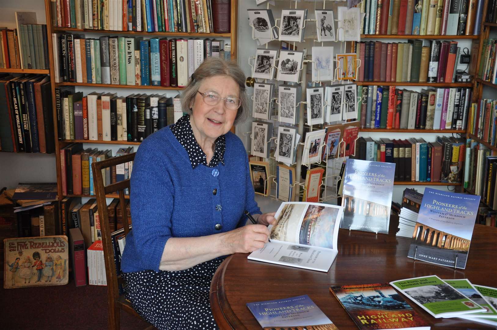 Author Anne-Mary Paterson signing one of her books.
