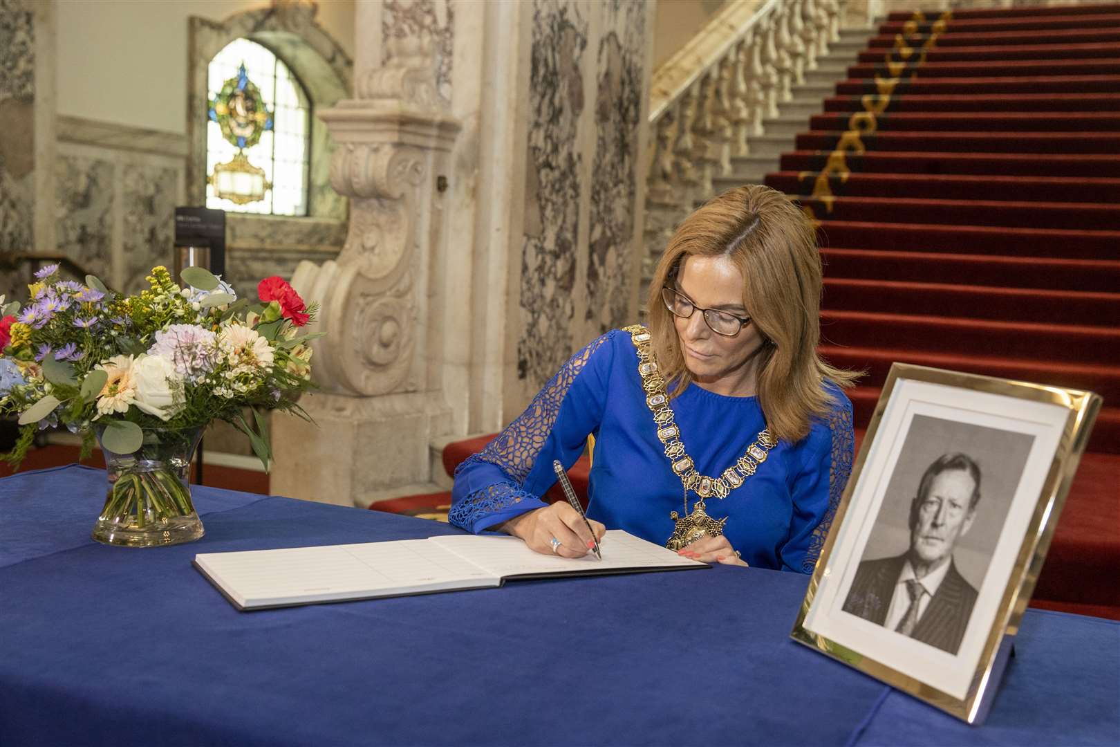 Lord Mayor of Belfast Tina Black opens a book of condolence at Belfast City Hall for former Northern Ireland First Minister and leader of the Ulster Unionist Party Lord David Trimble (Liam McBurney/PA)