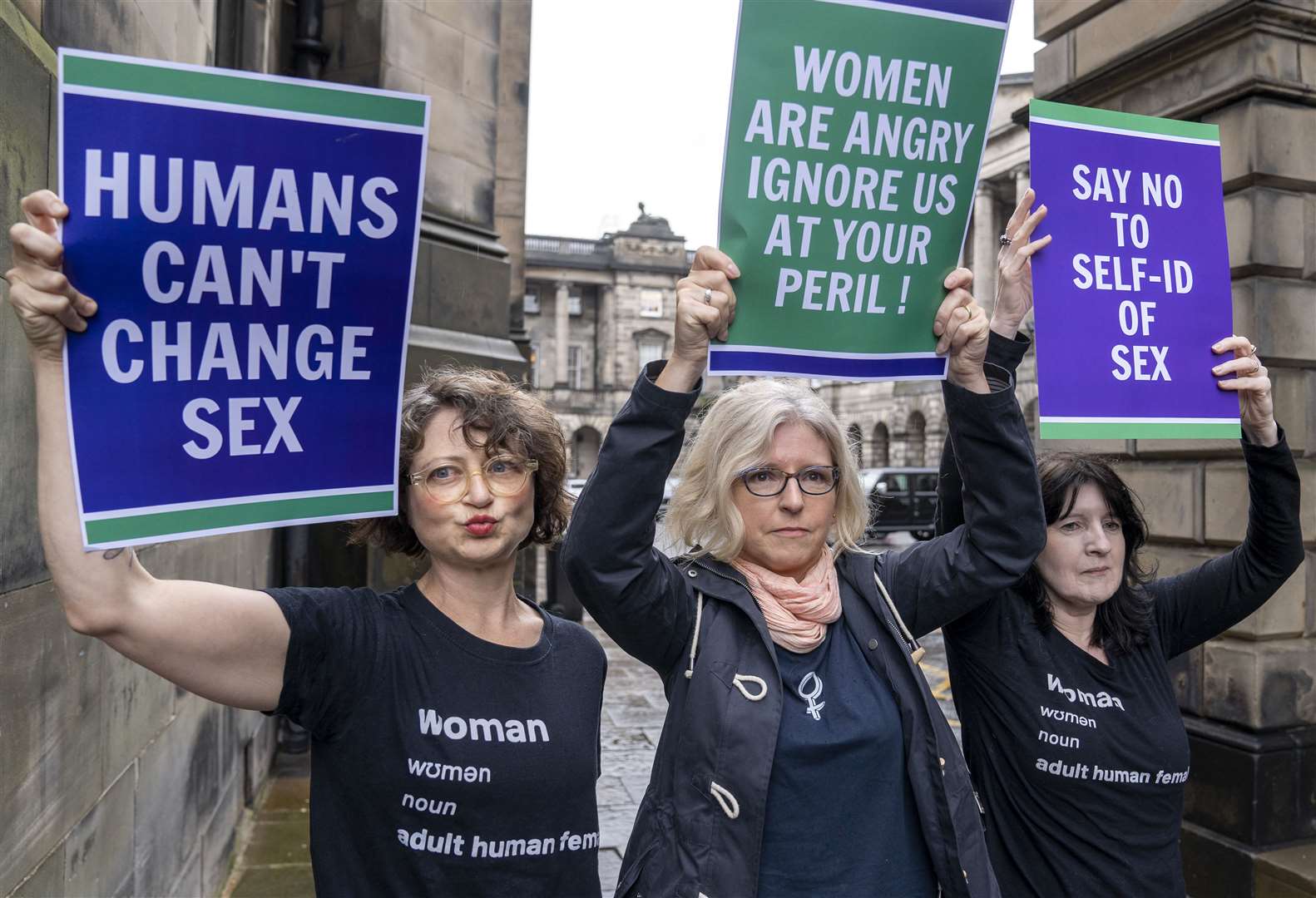 Members of the Scottish Feminist Network staged a demo outside the Court of Session (Jane Barlow/PA)