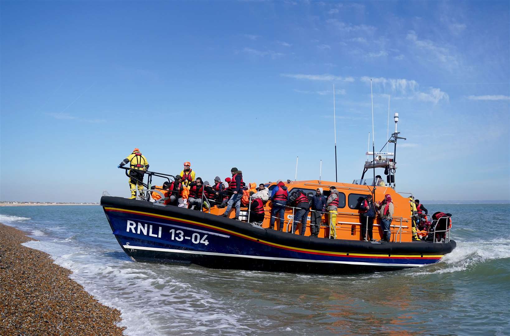 A group of people thought to be migrants are brought in to Dungeness (Gareth Fuller/PA)