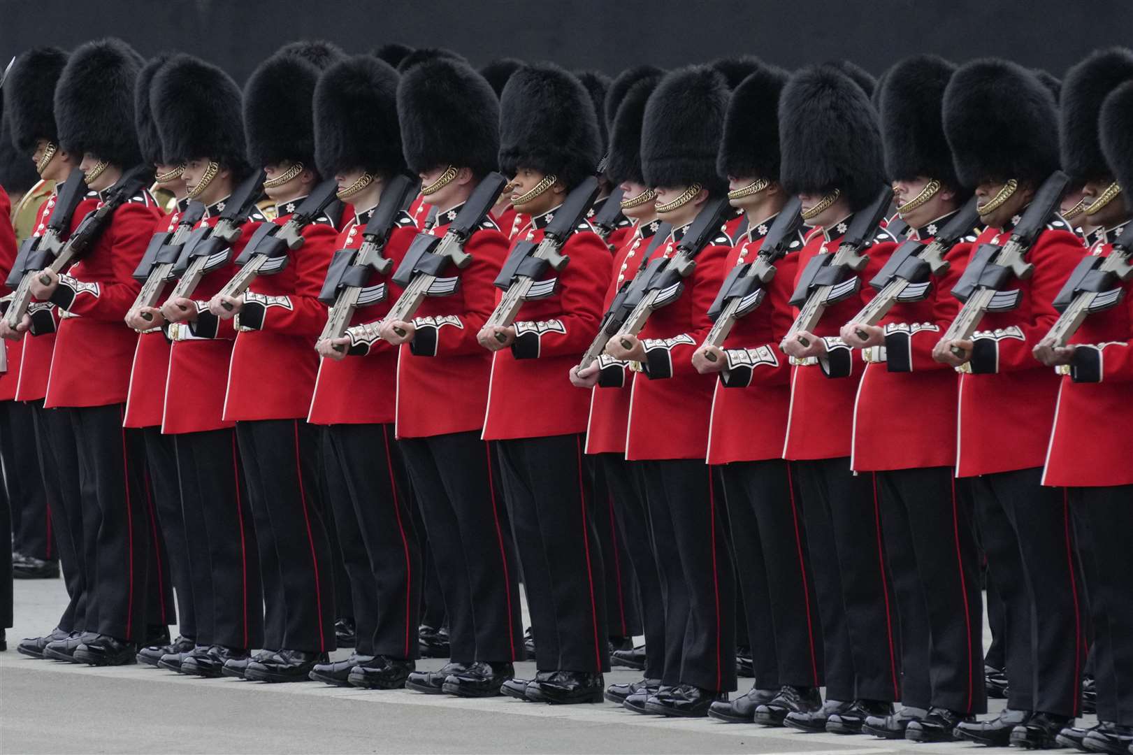 The Queen’s Guard line up at the Palace of Westminster ahead of the State Opening of Parliament (Kirsty Wigglesworth/PA)