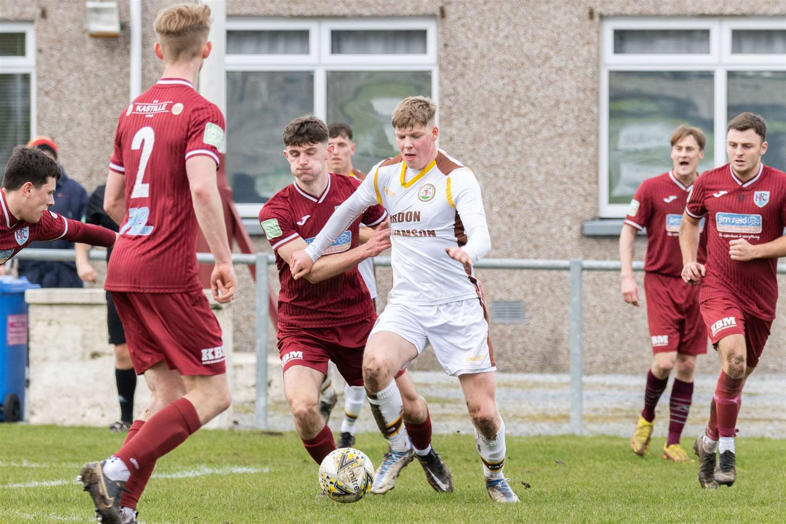 Forres' Ethan Cairns and Keith's Murray Addison compete for the ball. ..Keith F.C. v Forres Mechanics F. C. at Kynoch Park. ..Picture: Beth Taylor.