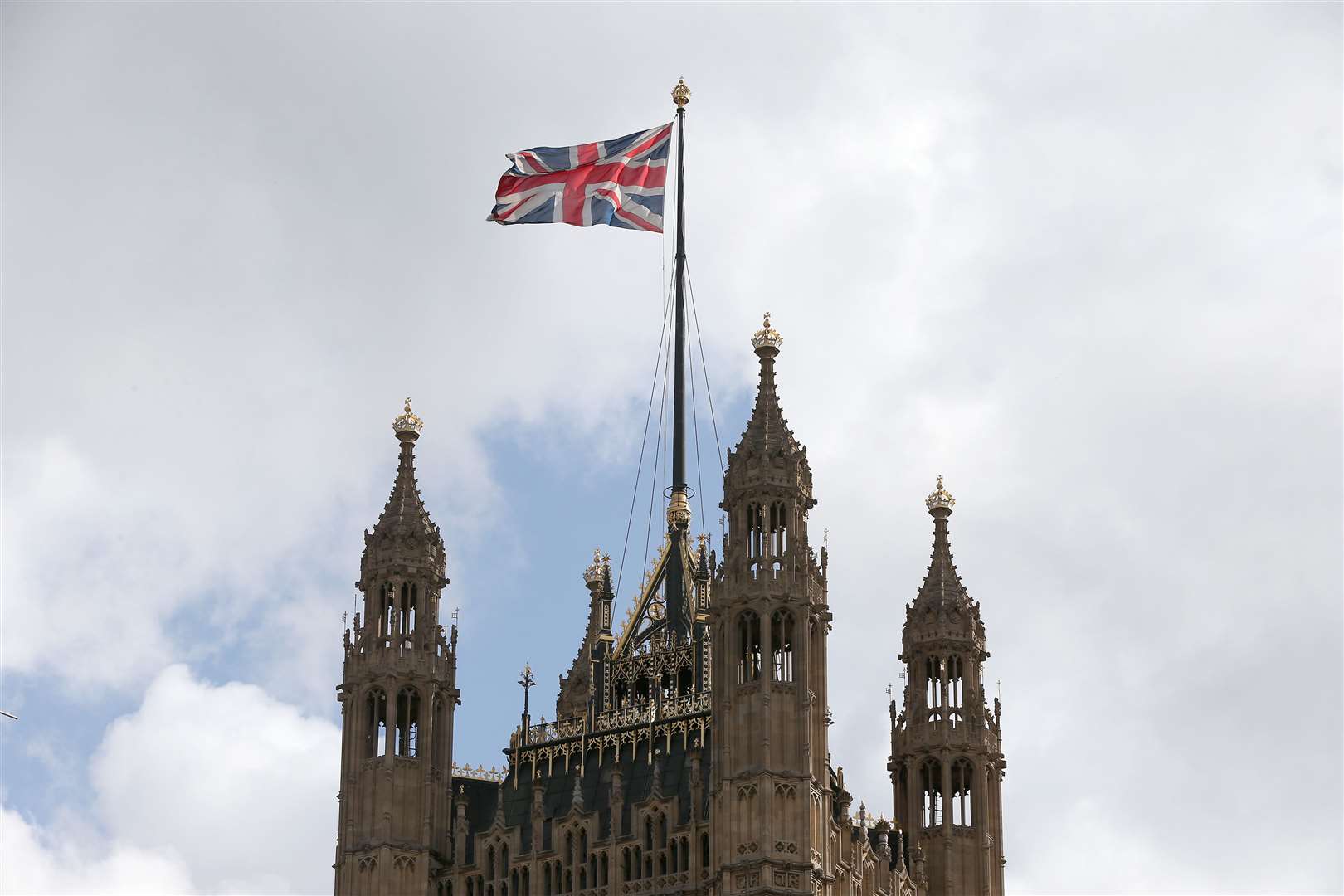 A Union flag flying from the Houses of Parliament in Westminster (Jonathan Brady/PA)